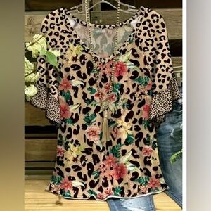 Animal/Floral print top with short sleeves.